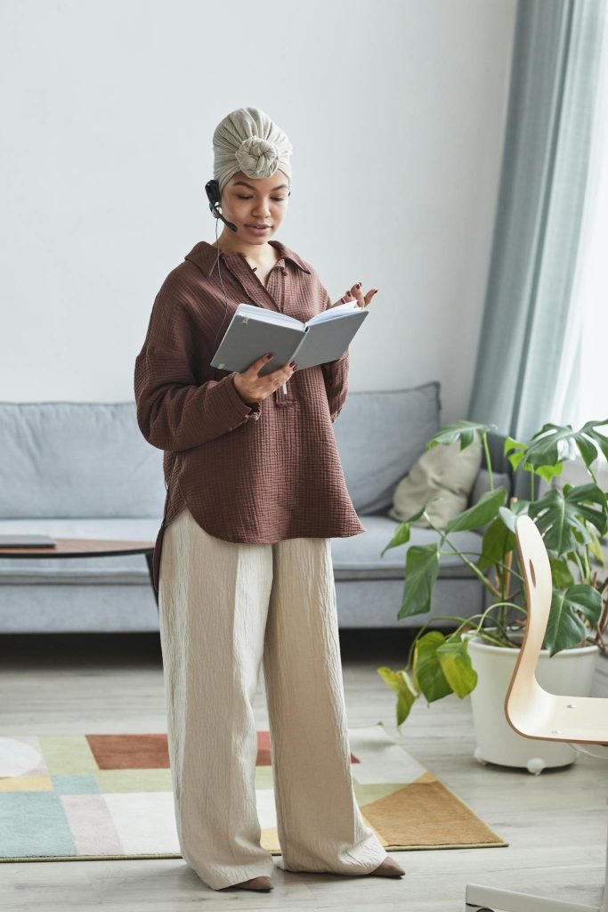 Black woman with handsfree headset and notebook